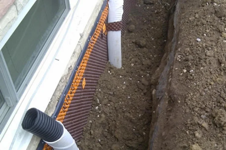 Basement Window Well Drain Installation to Prevent Water Intrusion